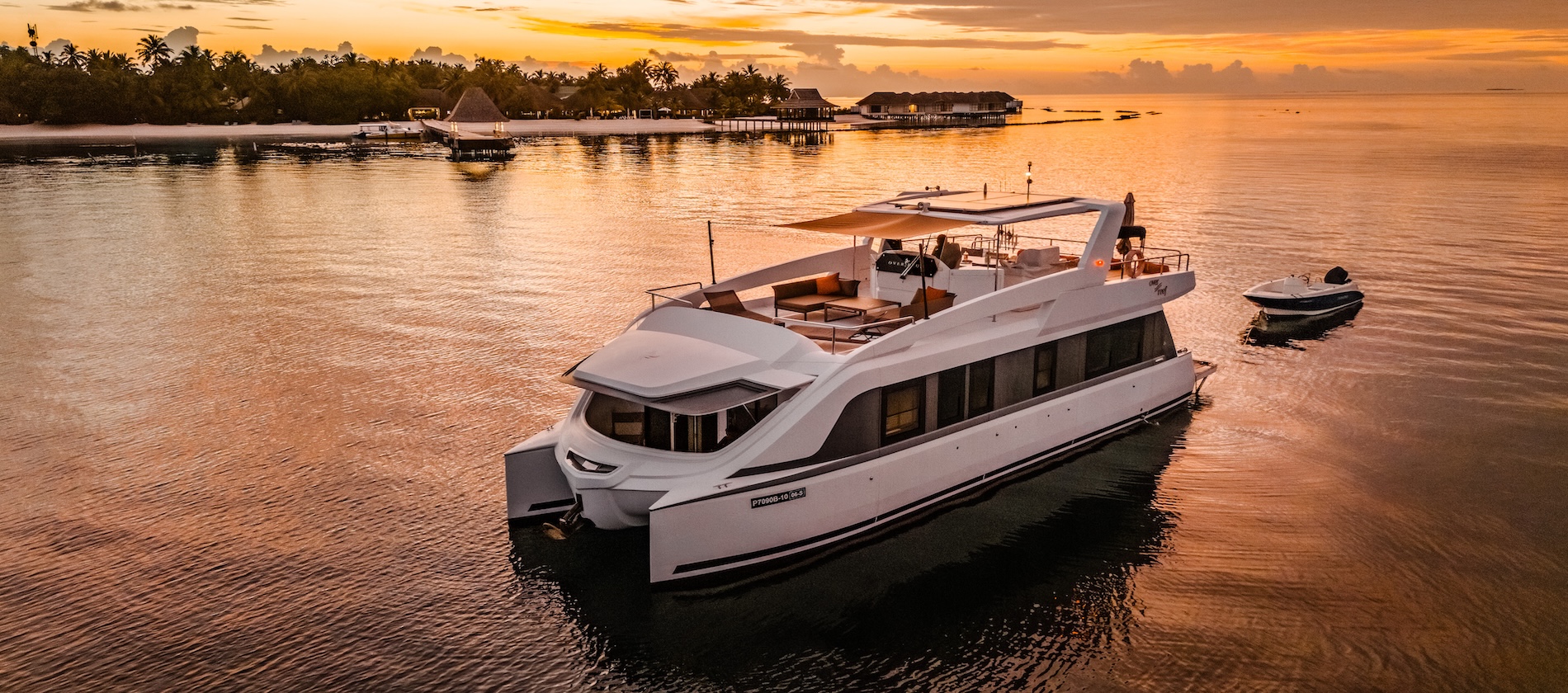 Over Reef anchored at sunset nearby a resort